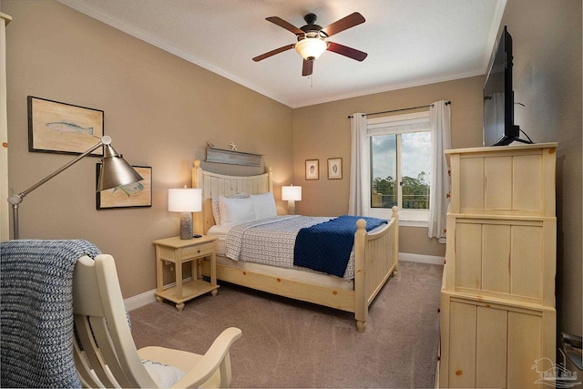 carpeted bedroom with crown molding and ceiling fan