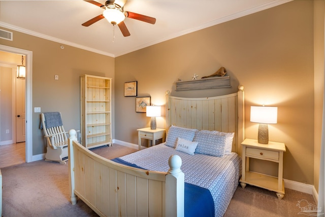 bedroom with carpet, crown molding, and ceiling fan