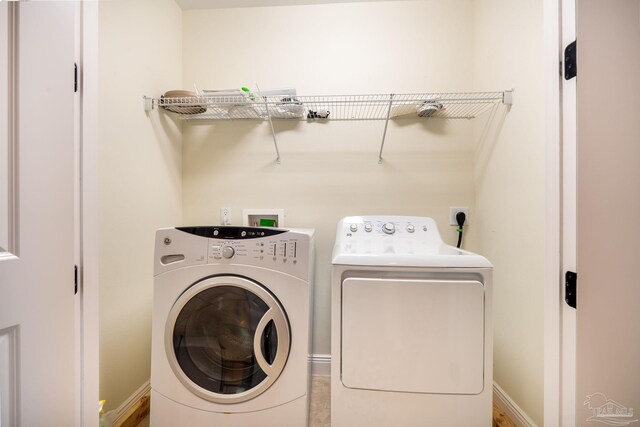 laundry area with washing machine and dryer