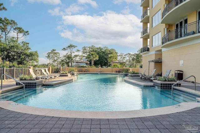 view of swimming pool with a patio