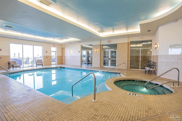 view of pool featuring an indoor hot tub