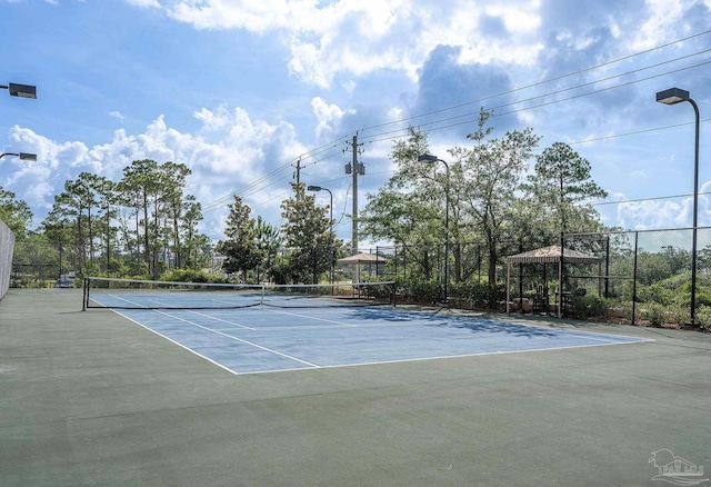 view of tennis court featuring a gazebo