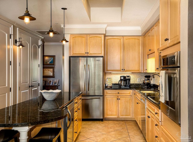 kitchen with light tile patterned floors, sink, pendant lighting, a breakfast bar, and stainless steel appliances