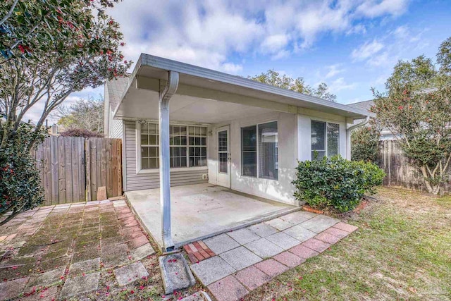 back of property featuring a patio area