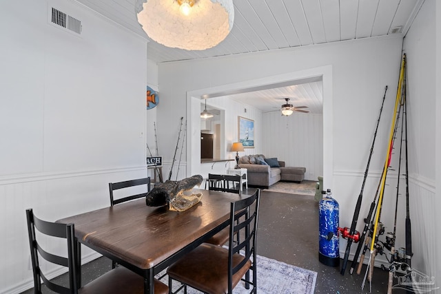 dining space with wooden ceiling, a ceiling fan, visible vents, and ornamental molding