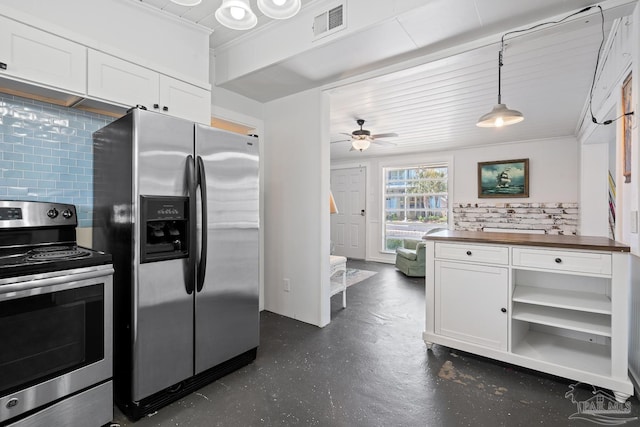 kitchen featuring visible vents, decorative backsplash, appliances with stainless steel finishes, and white cabinets