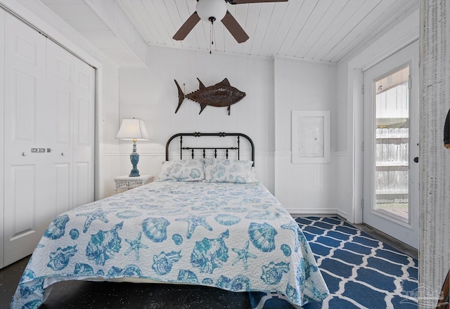 bedroom featuring a closet, wood ceiling, and ceiling fan