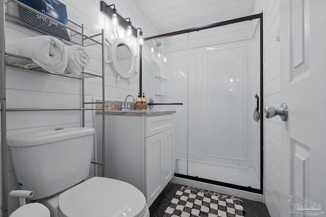 bathroom with toilet, a stall shower, tile patterned floors, and vanity