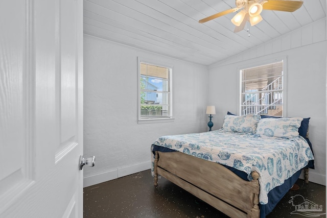 bedroom with wooden ceiling, multiple windows, baseboards, and vaulted ceiling