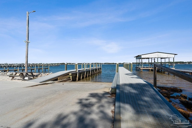 dock area featuring a water view