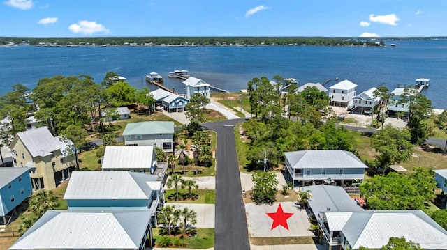 aerial view with a water view and a residential view
