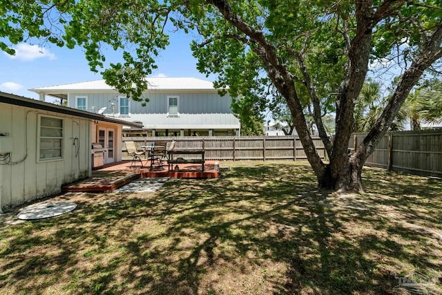 view of yard featuring a fenced backyard and a deck