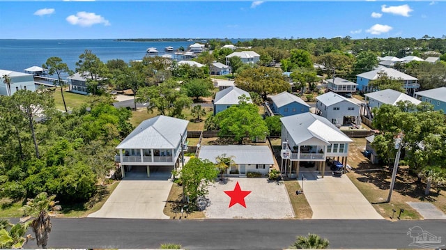 bird's eye view with a water view and a residential view