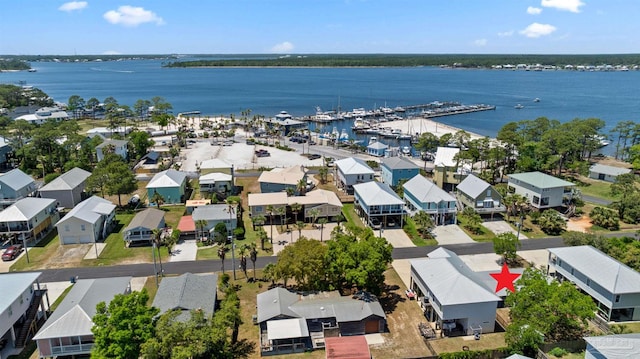 birds eye view of property featuring a water view and a residential view