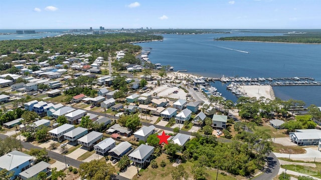 birds eye view of property with a water view and a residential view