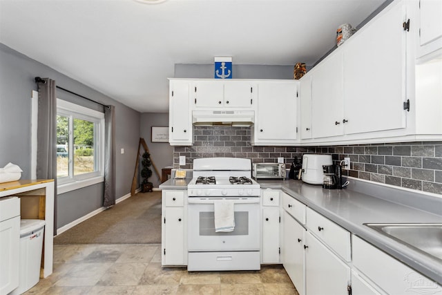 kitchen featuring white cabinetry, backsplash, sink, and gas range gas stove