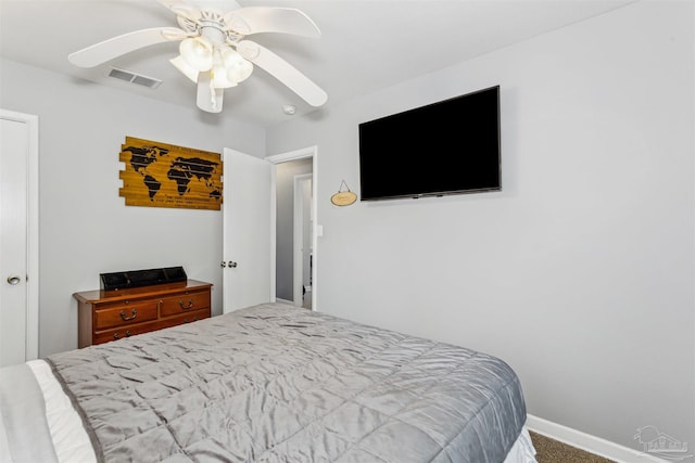 bedroom featuring ceiling fan and carpet