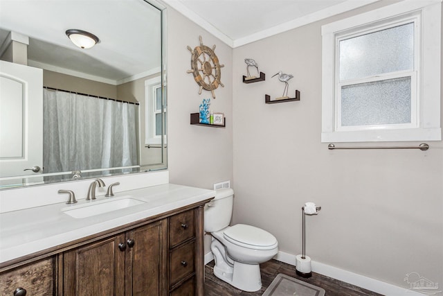 bathroom featuring vanity, hardwood / wood-style floors, crown molding, and toilet