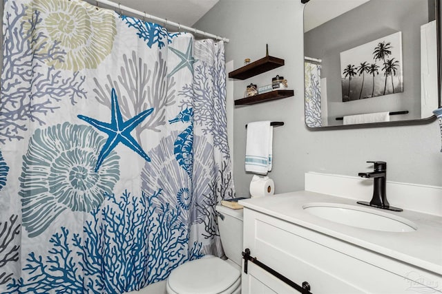 bathroom with vanity and toilet