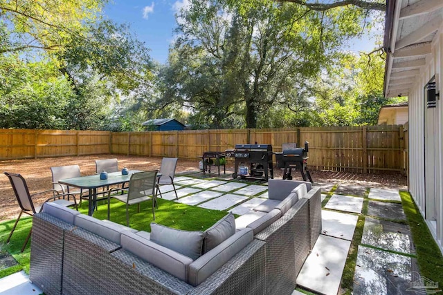 view of patio / terrace with a grill and outdoor lounge area