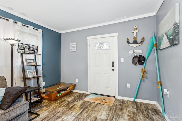 foyer featuring hardwood / wood-style flooring and ornamental molding