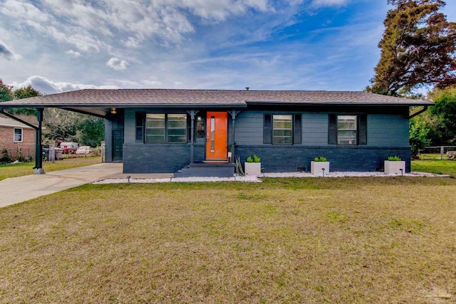 ranch-style house with a carport, a front yard, brick siding, and driveway