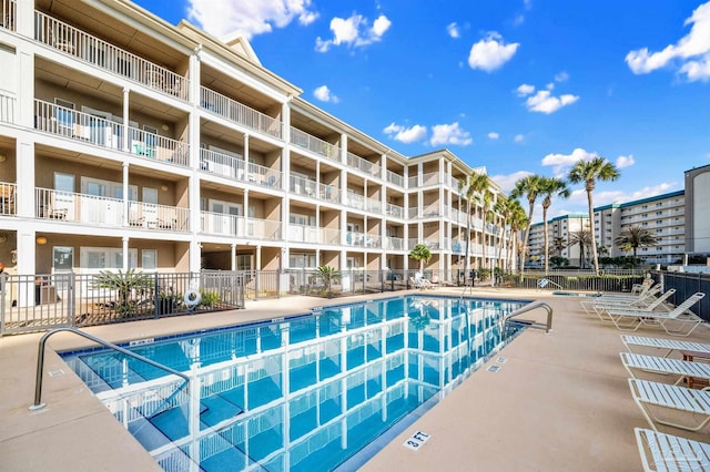 view of swimming pool with central AC unit and a patio area