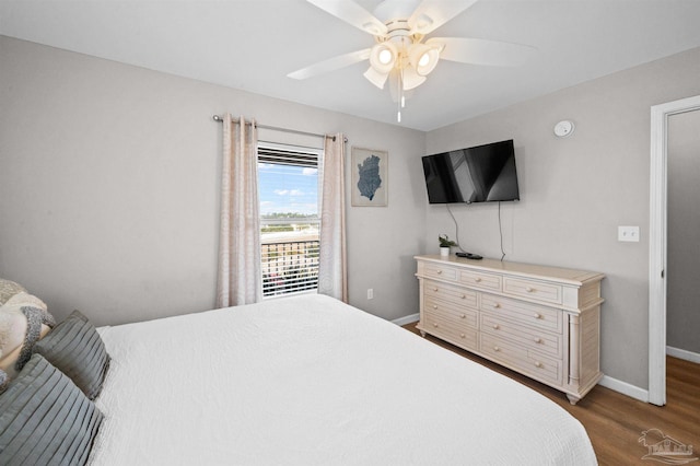 bedroom featuring hardwood / wood-style floors and ceiling fan