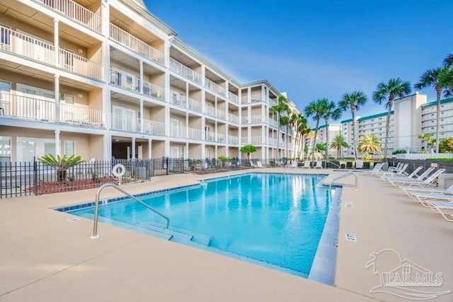 view of swimming pool with a patio