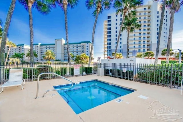 view of swimming pool featuring a patio area