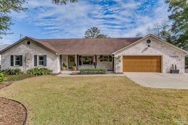 single story home with a garage and a front lawn