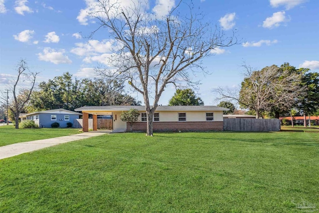 single story home with a front lawn and a carport