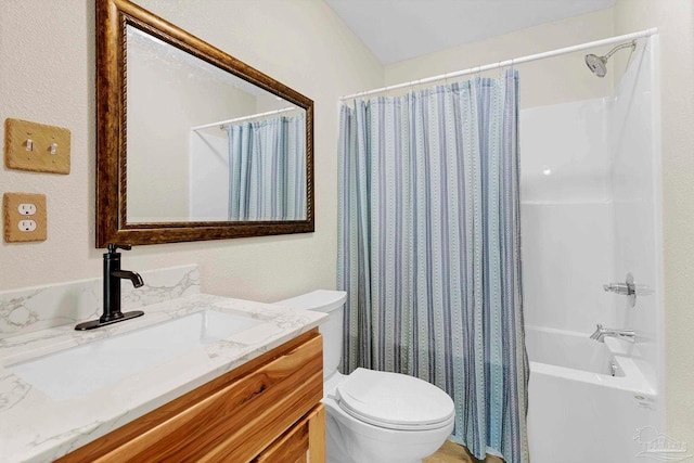 full bathroom featuring vanity, toilet, and shower / tub combo with curtain