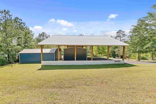 surrounding community with a lawn and an outdoor structure