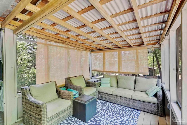 sunroom featuring an outdoor living space