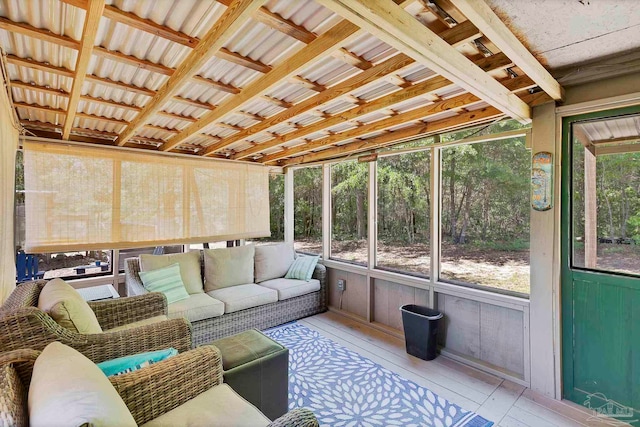 sunroom / solarium featuring outdoor lounge area