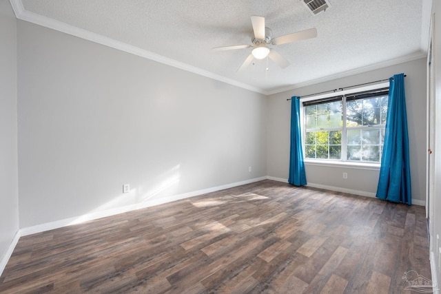 spare room featuring ceiling fan, dark hardwood / wood-style flooring, a textured ceiling, and crown molding