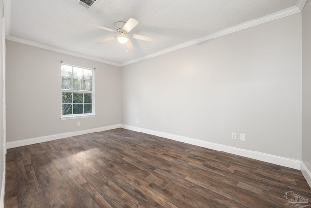 empty room featuring dark hardwood / wood-style flooring, a textured ceiling, and ornamental molding