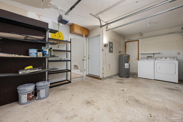 garage featuring electric panel, independent washer and dryer, a garage door opener, and water heater