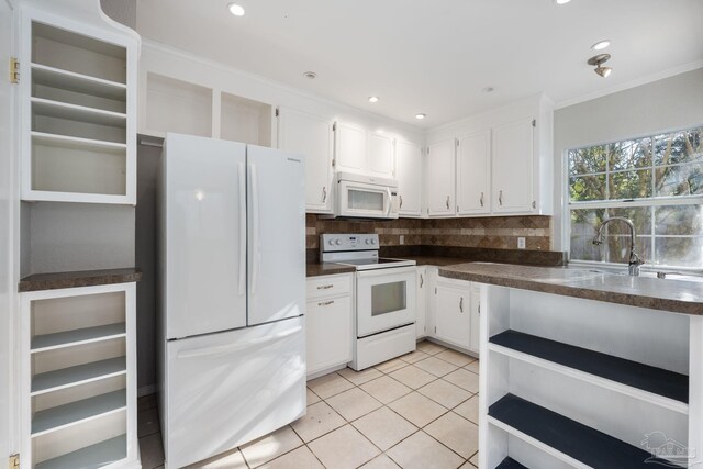 kitchen with backsplash, white cabinetry, light tile patterned floors, and white appliances