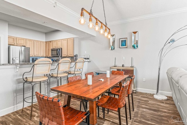 dining space with a textured ceiling, crown molding, and dark wood-type flooring