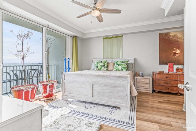 bedroom featuring ornamental molding, light wood-type flooring, ceiling fan, and access to outside