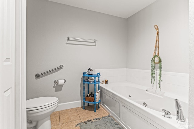 bathroom featuring a bath, tile patterned floors, and toilet