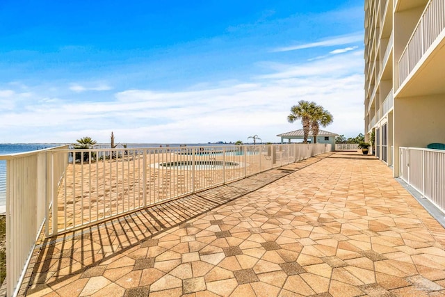 view of patio / terrace featuring a water view