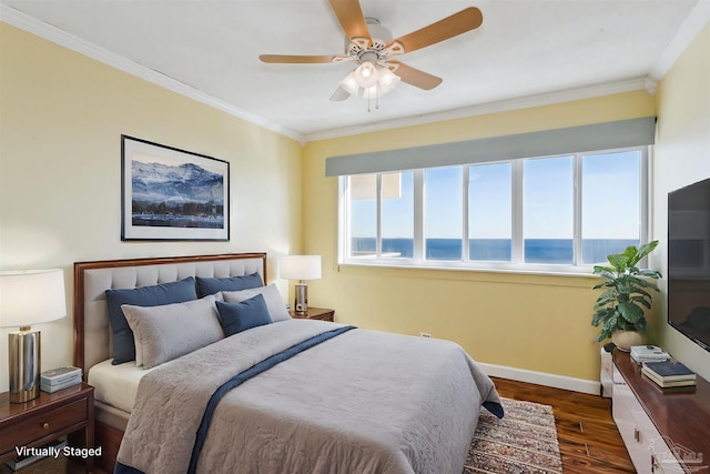 bedroom with ceiling fan, ornamental molding, dark wood-type flooring, and multiple windows