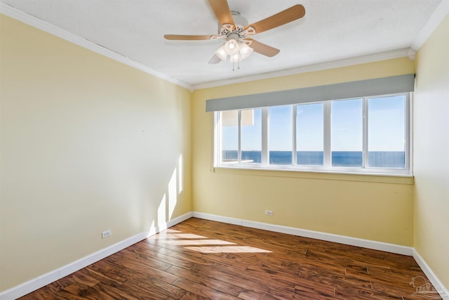 unfurnished room with wood-type flooring, a water view, ceiling fan, and ornamental molding