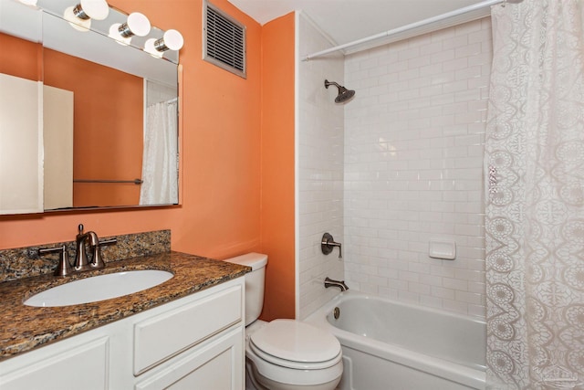 full bathroom featuring vanity, shower / bath combination with curtain, and toilet