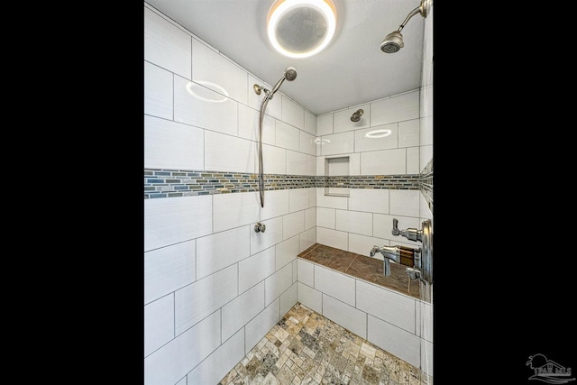 bathroom featuring a tile shower