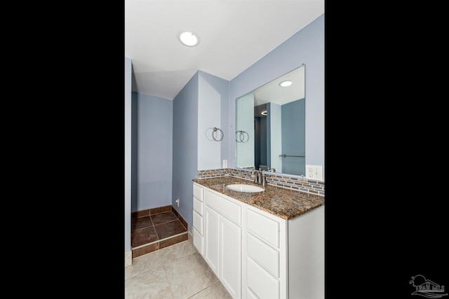 bathroom with tile patterned flooring and vanity