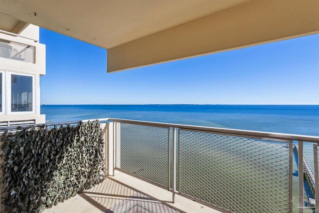 balcony featuring a water view